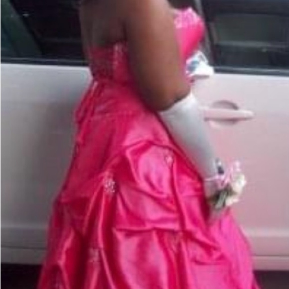 Fuchsia pink sweetheart neck line with rhinestone accent